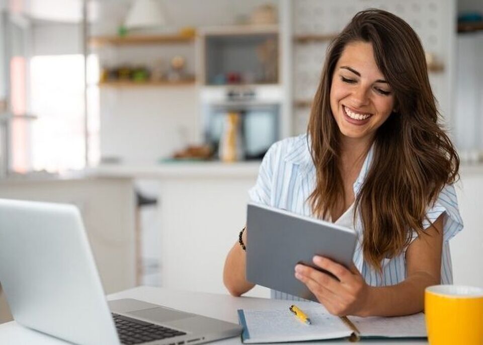 Younger white woman at computer